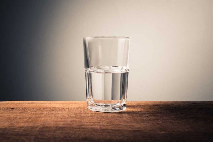 Glass,Of,Water,With,Half,Full,Water,On,The,Table, Glass Half Empty or Full? Science Weighs In on a Better Measure