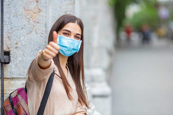 Woman,Doing,Thumbs,Up,Gesture,Wearing,A,Protective,Mask.,Young The Danger of Toxic Positivity During a Pandemic