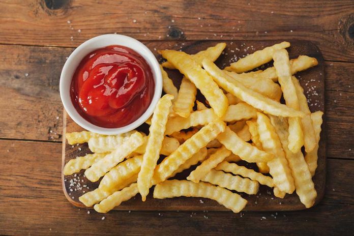 French,Fries,With,Ketchup,On,Wooden,Board,,Top,View DANGER: Reasons Experts Urge You to Skip a Side of Fries