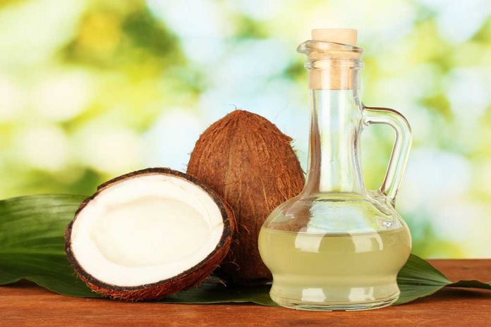 Decanter,With,Coconut,Oil,And,Coconuts,On,Green,Background 7 Amazing Ways to Use Coconut Oil This Summer