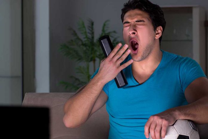 Young,Man,Watching,Football,Late,At,Night 4 Reasons to Keep the TV Off At Night