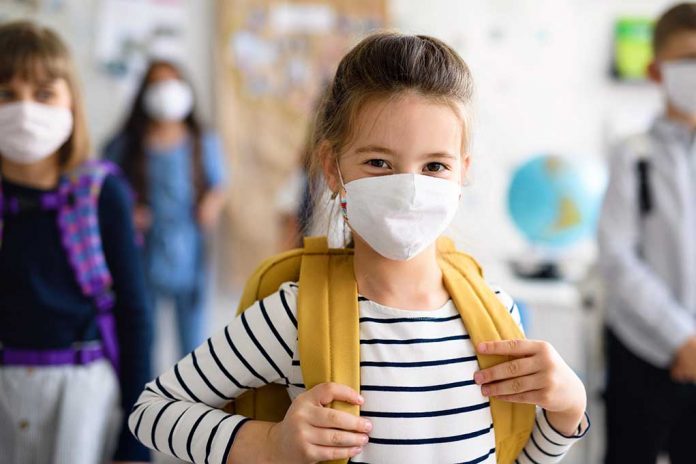 Child,With,Face,Mask,Going,Back,To,School,After,Covid-19 5 Ways to Keep Kids Safe From COVID