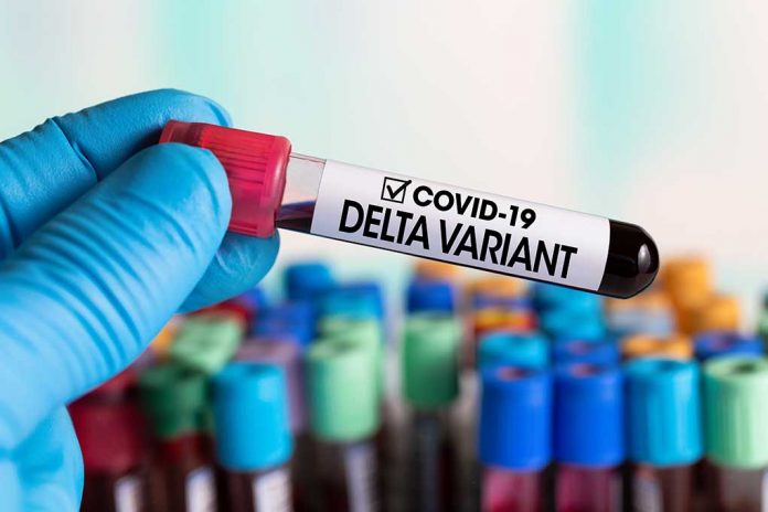 Technician,Holding,Tube,Of,Blood,Test,Identified,With,The,Label 5 Facts EVERYONE Should Know About the Delta Variant