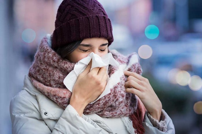 Pretty,Young,Woman,Blowing,Her,Nose,With,A,Tissue,Outdoor WOAH! The Next Flu Season Might Be Severe: Here's What We Can Do About It