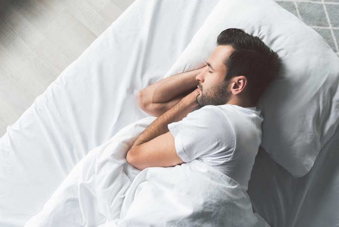 Cute,Young,Man,Sleeping,On,Bed Science Uncovers 4 Types of Sleepers: Identify YOUR Sleeping Style