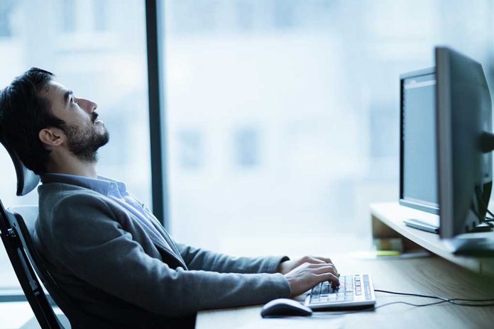 Overworked,Tired,Employee,At,Workplace,In,Office,Being,Unhappy Warning Signs of a Toxic Workplace & What To Do About It
