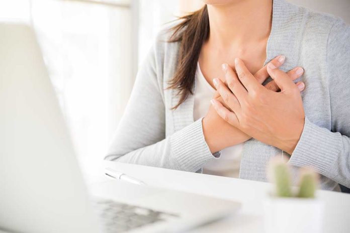 Closeup,Business,Woman,Having,Heart,Attack.,Woman,Touching,Breast,And 7 Daily Habits That Could Be Harming Your Heart