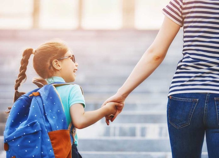 Parent,And,Pupil,Of,Primary,School,Go,Hand,In,Hand. 5 Health Hacks for Heading Back to School